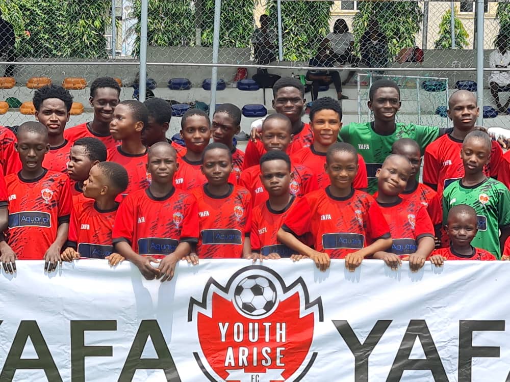 Youth Arise Football Academy players celebrating after a match
